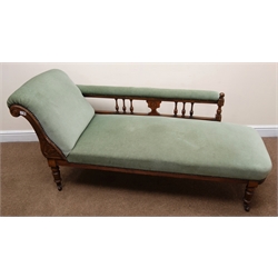  Edwardian walnut framed chaise longue, scrolled arm, turned supports, upholstered in a light green fabric, L160cm  