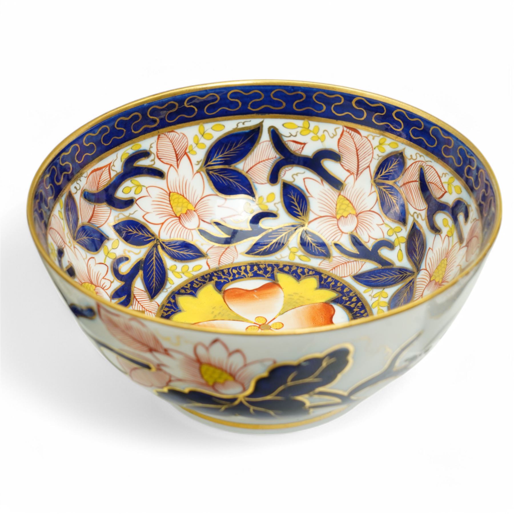 English porcelain Imari tea and coffee wares, pattern 1277, decorated with central orange floral motif surrounded by sprigs of yellow foliage within blue borders, comprising eleven teacups, eight coffee cups, twelve saucers, two shallow bowls and one finger bowl