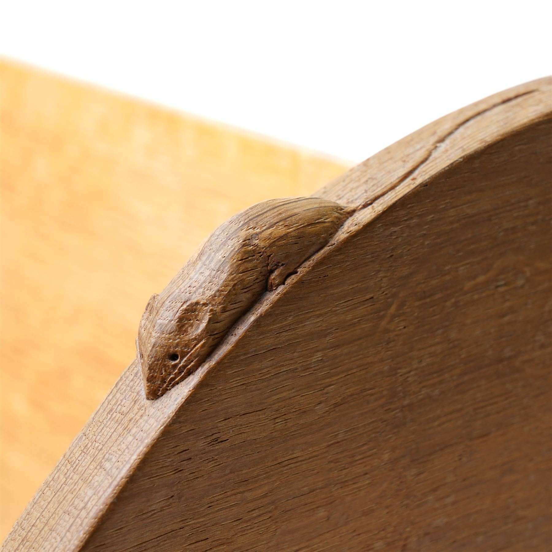 Mouseman - oak book trough, curved end supports, with carved mouse signature, by the workshop of Robert Thompson, Kilburn W45cm