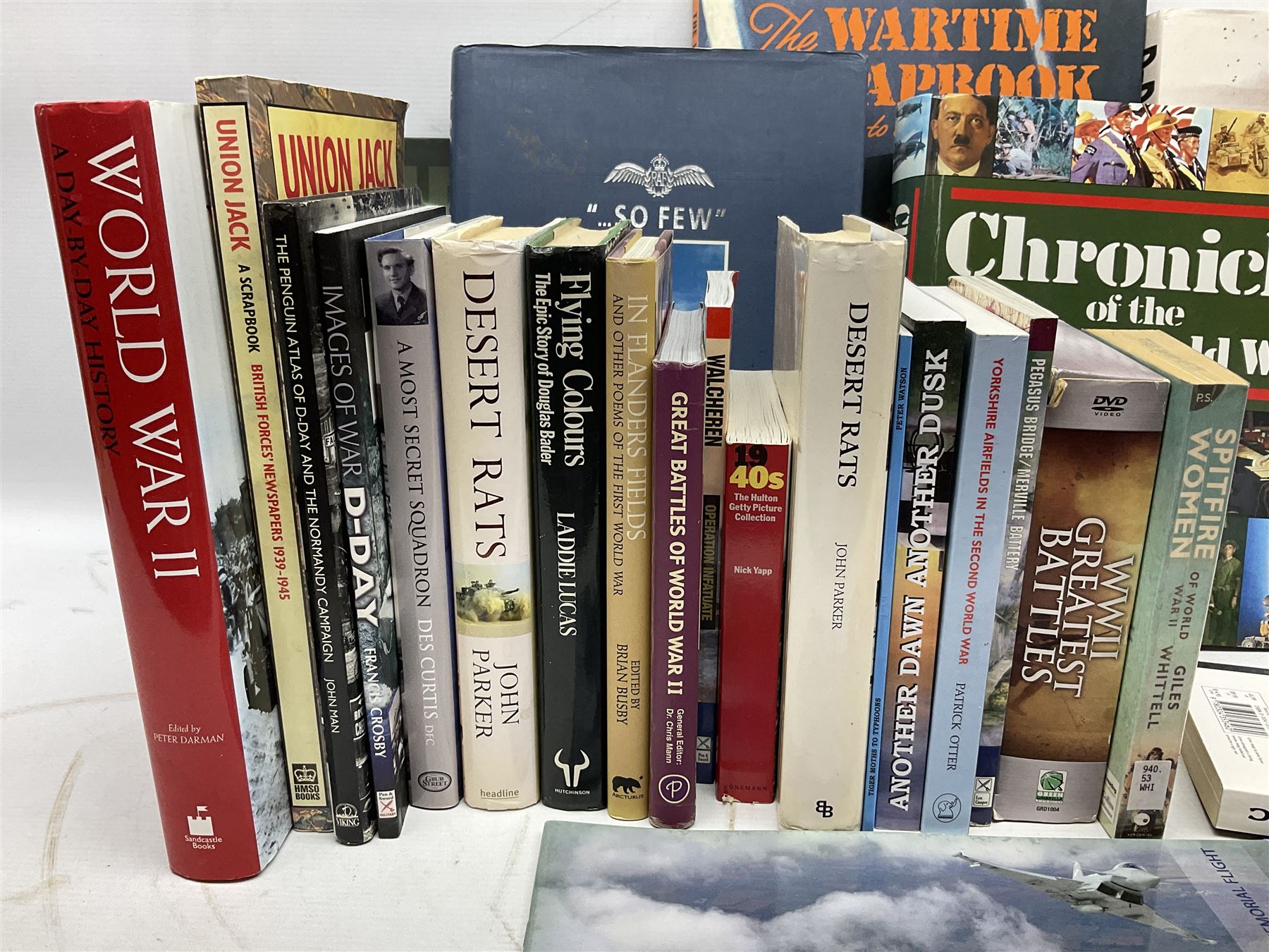 Thirty modern books of military interest including The Wartime Scrapbook 1939-1945; D-Day by Stephen Badsey; The D-Day Experience by Richard Holmes; Desert Rats by John Parker; A Most Secret Squadron by Des Curtis; Flying Colours - The Epic Story of Douglas Bader by Laddie Lucas etc; and quantity of DVDs of war and military interest