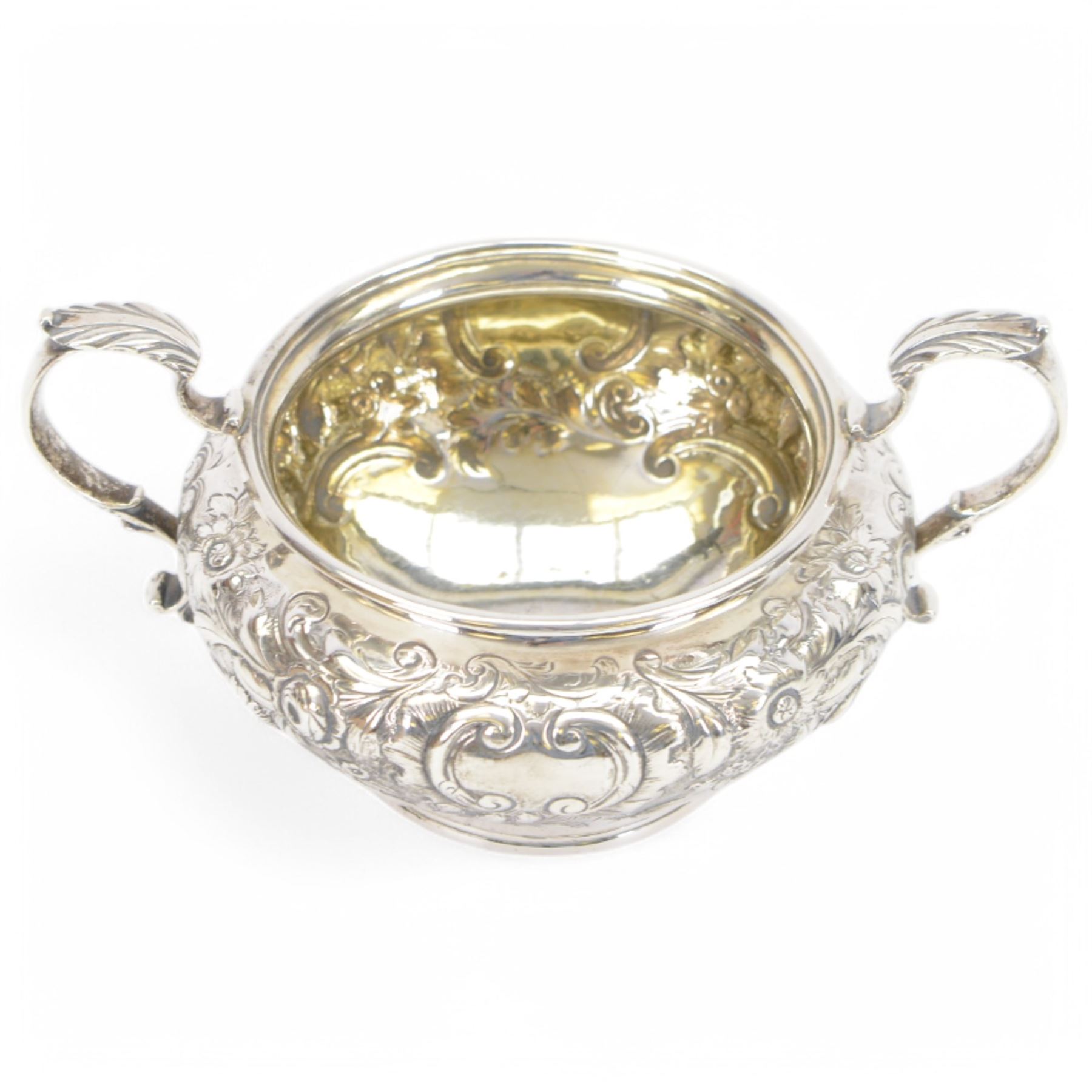 William IV silver twin handled sugar bowl, embossed with flowers and scrolling decoration with acanthus capped twin handles, hallmarked J Wrangham & William Moulson, London 1837, H10cm, D14cm