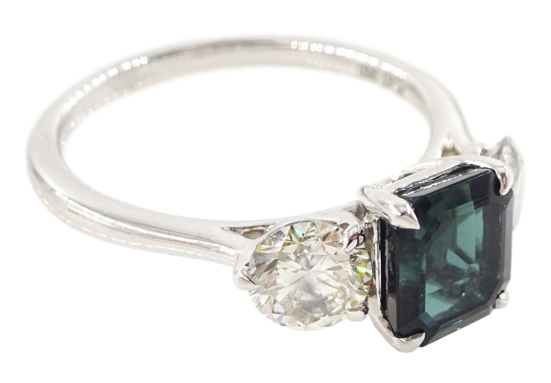 Platinum tourmaline and diamond three stone ring, single octagonal cut green tourmaline of approx 1.65 carat, with a round brilliant cut diamond set either side, stamped PT 950, total diamond weight approx 1.05 carat