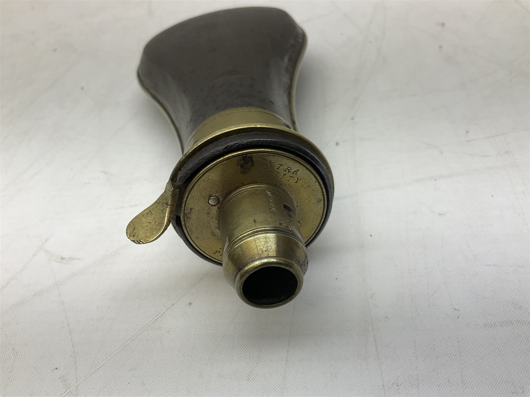 Two Sykes Patent brass mounted small load powder flasks with fire proof safety tops - one with slim plain copper body H17.5cm; the other with plain gun metal body H19cm (2)