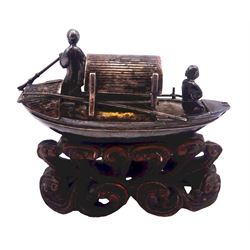 Chinese miniature silver model of a junk, with character mark to stern, mounted upon a carved wooden stand, overall H5cm L6.5cm