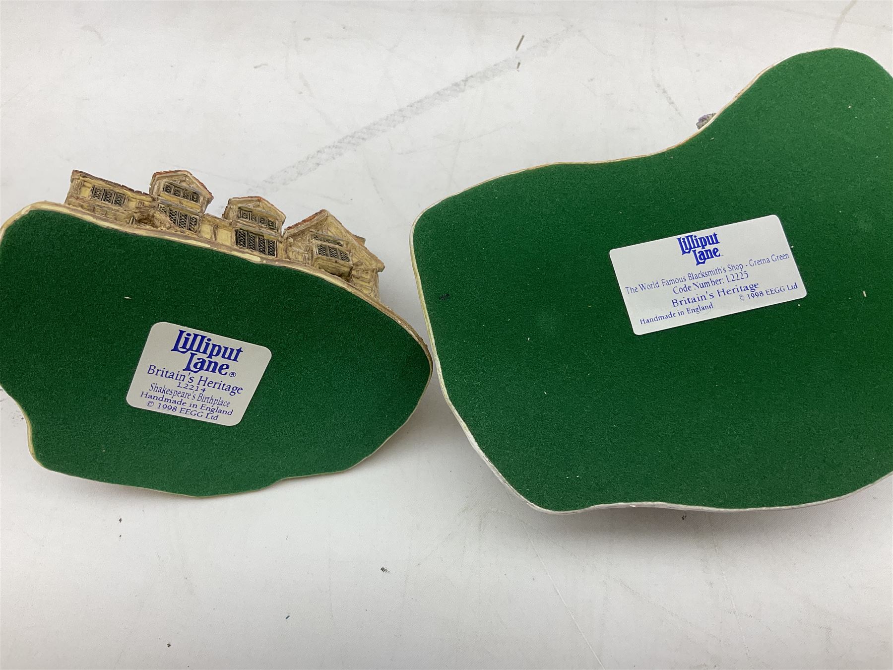 Four Lilliput Lane models from the 'Britain's Heritage' collection, comprising Edinburgh Castle, The World Famous Blacksmith's Shop Gretna Green, Shakespeare's Birthplace and Mickelgate Bar York, together with  a Lilliput Lane Beatrix Potter Hill Top model, all boxed