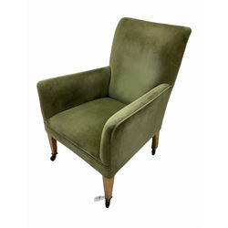 Early 20th century beech framed armchair, upholstered in green fabric, square tapering front supports, brass and ceramic castors