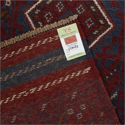 Afghan hand-knotted wool runner, dark red and indigo blue madder, with a repeating diamond medallion design within multiple geometric borders, with flatweave ends 