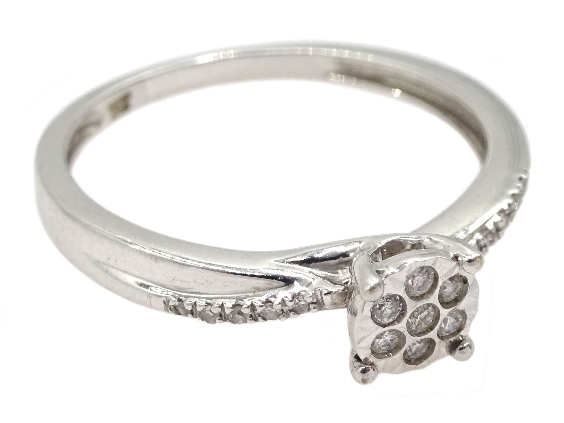 9ct white gold diamond cluster ring, with diamond set shoulders by Warren James, hallmarked, boxed with bag