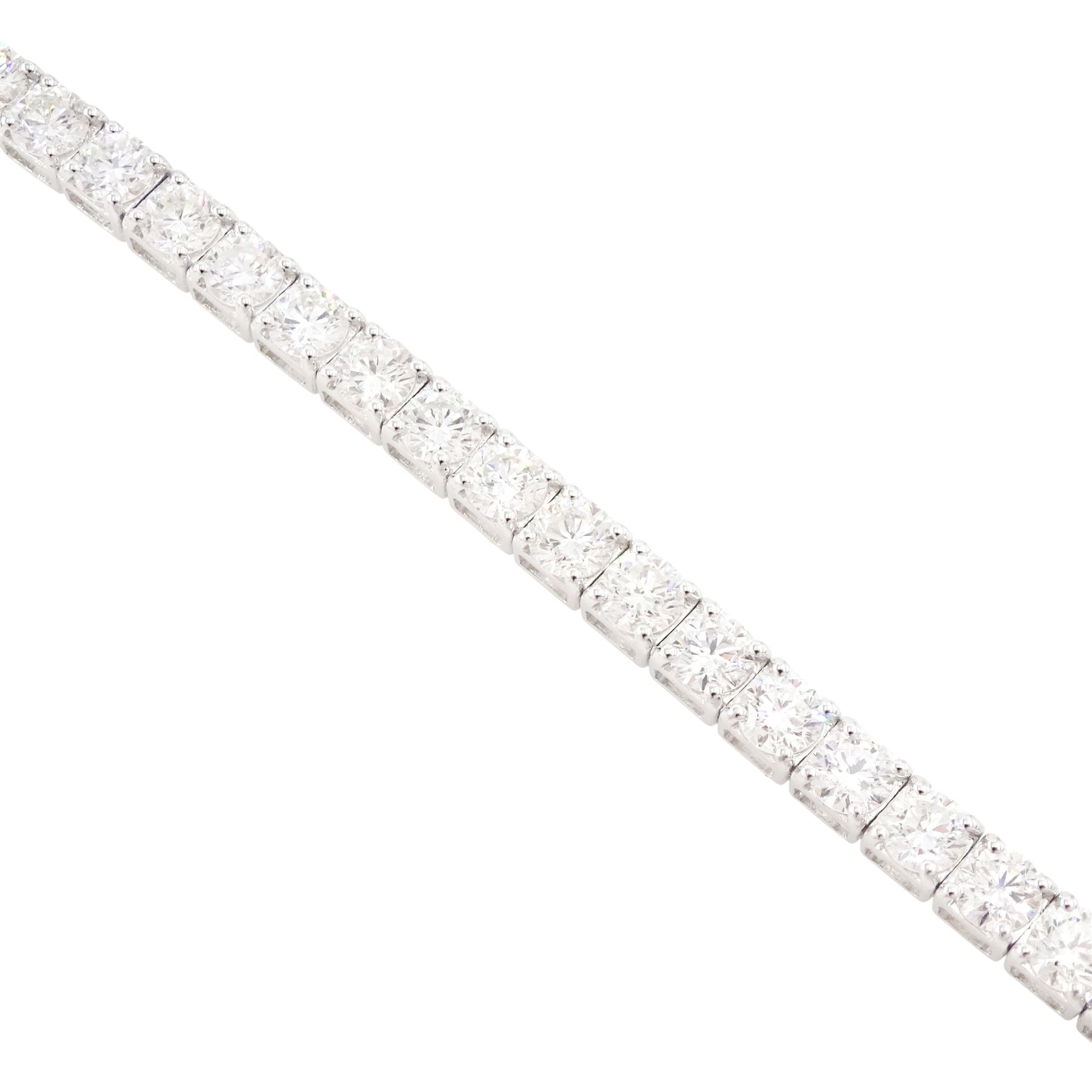 18ct white gold diamond bracelet, four claw set with fifty-one round brilliant cut diamonds, stamped 750, total diamond weight approx 6.35 carat
