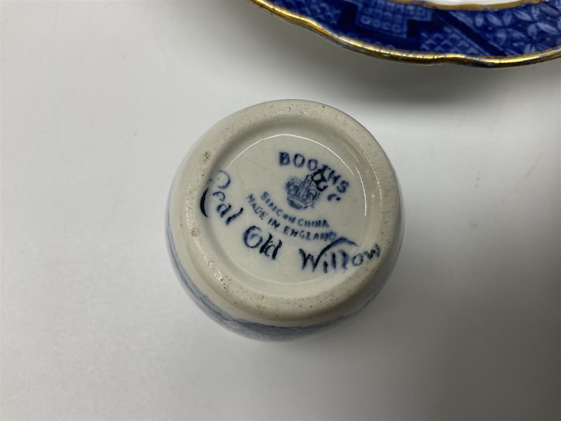 Booths Real Old Willow pattern part tea and dinner service, to include two meat platters, cake stand, teapot, two jugs, sugar bowl, sauce boat, teacups and saucers and a collection of plates and bowls