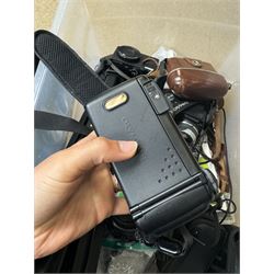 Collection of cameras and camera equipment, including Voigtlander Vitomatic I, Nikon Coolpix P340, Nikon Coolpix S9100, Olympus SP-510UZ, tripod, cases, etc