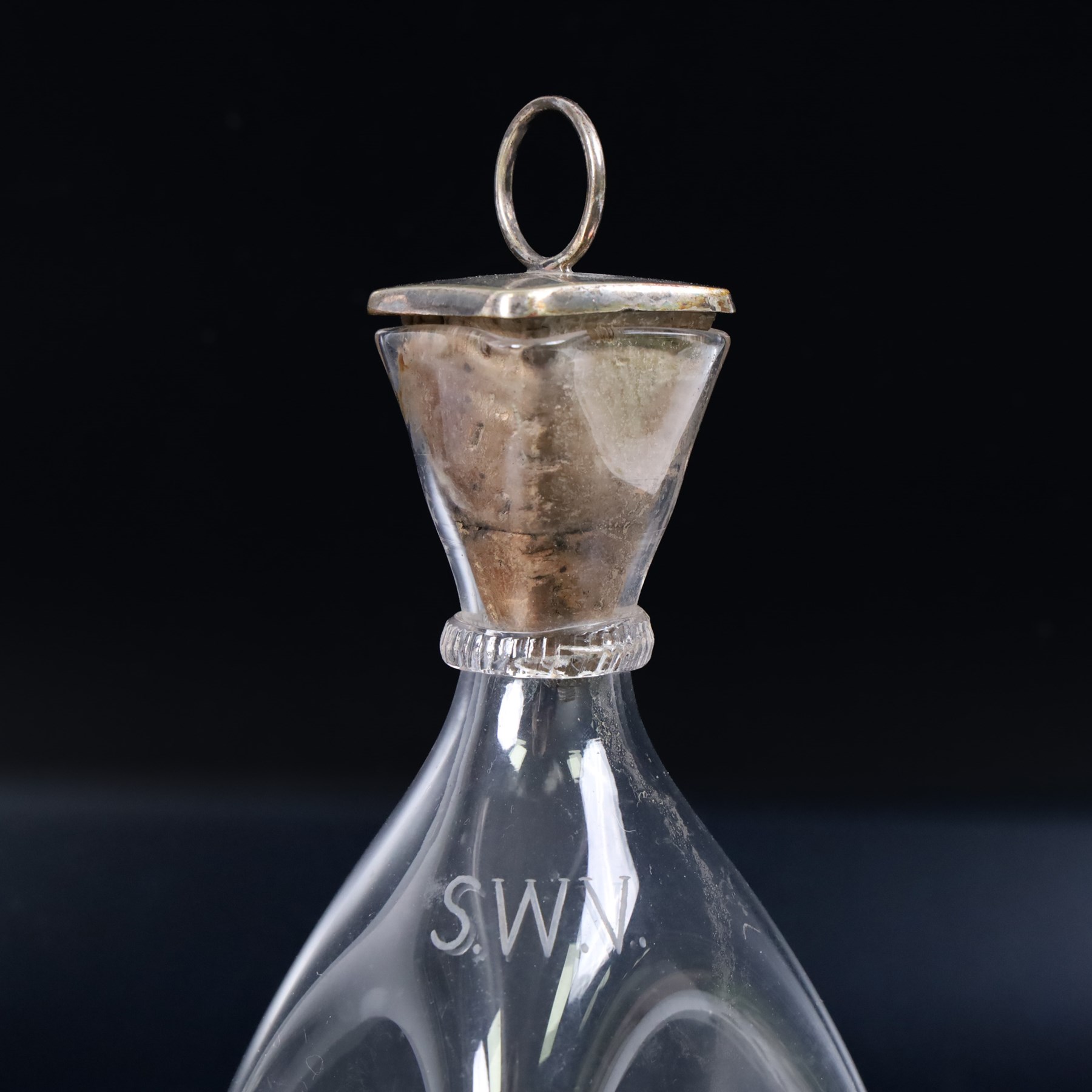 Four Arts and Crafts drinking glasses of dimple form, probably James Powell, Whitefriars, together with a dimple decanter, glasses H12cm