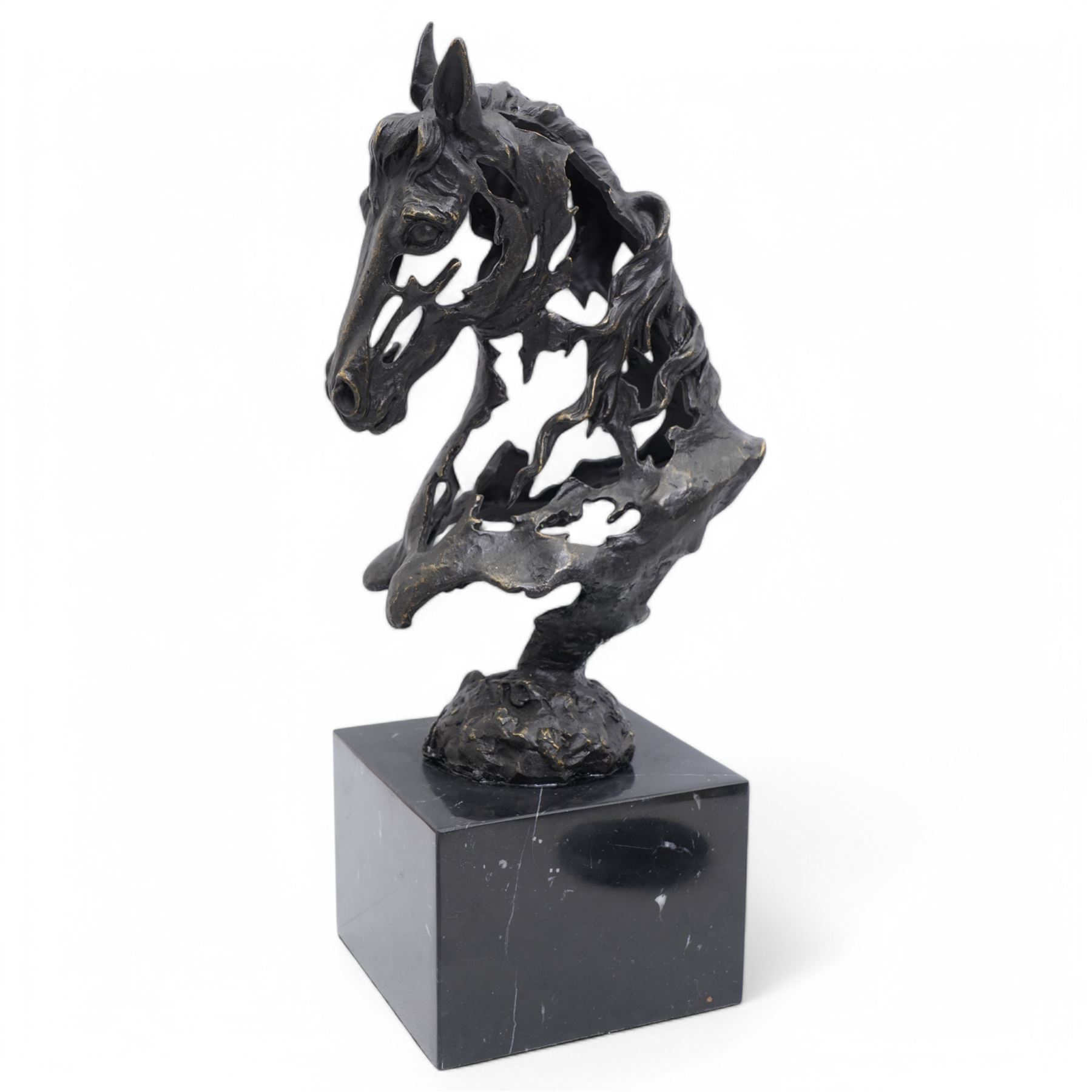 Bronze figure, modelled as a stylised horses head, upon a square marble plinth, signed and bearing foundry mark, overall H41cm