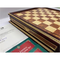 Franklin Mint House of Faberge 'The Imperial Jewelled Chess Set', to include set of chess pieces with malachite finish and a set with carnelian finish and a hardwood chess board