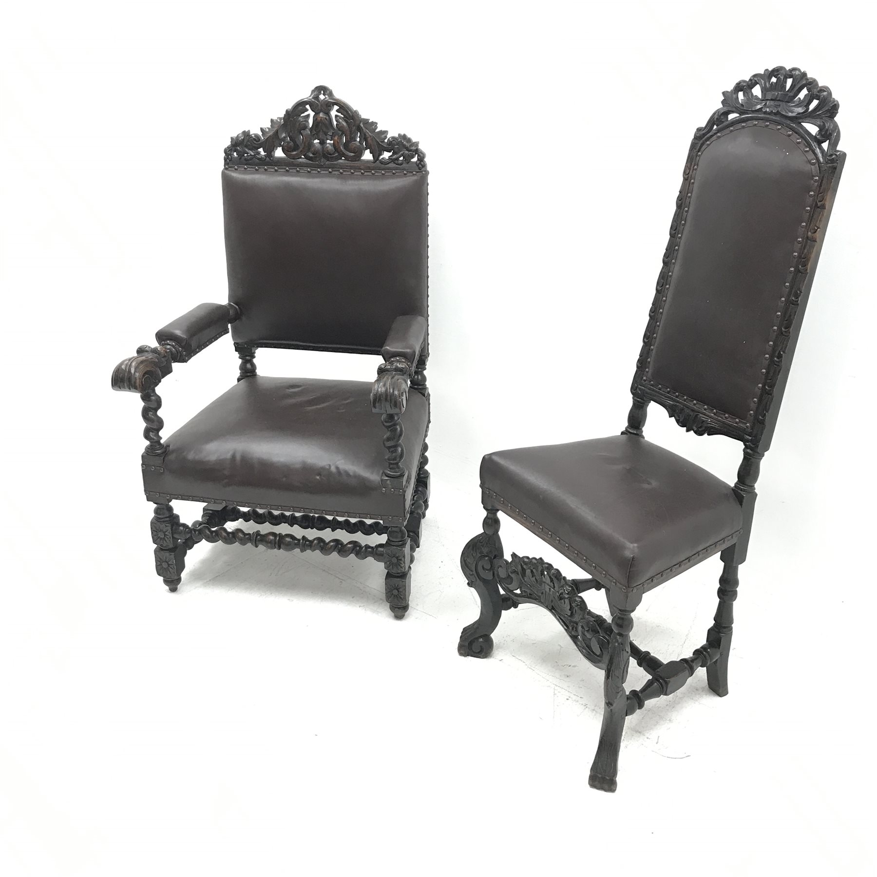 Jacobean style oak library chair, floral carved and pierced cresting rail, upholstered back seat and arms, barley twist supports (W68cm) and a similar oak hall chair, carved cresting rail and supports, upholstered back and seat (W52cm)