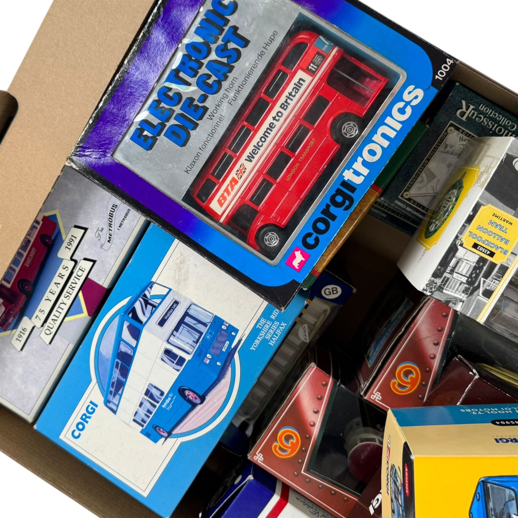 Collection of Corgi buses, trams and coaches, including Blackpool Balloon Tram no. 43502, Van Hool T9 Caelloi Motors no. AN45904 and The Connoisseur Collection Bedford Val Wallace Arnold Tours no. 35305, etc, all boxed