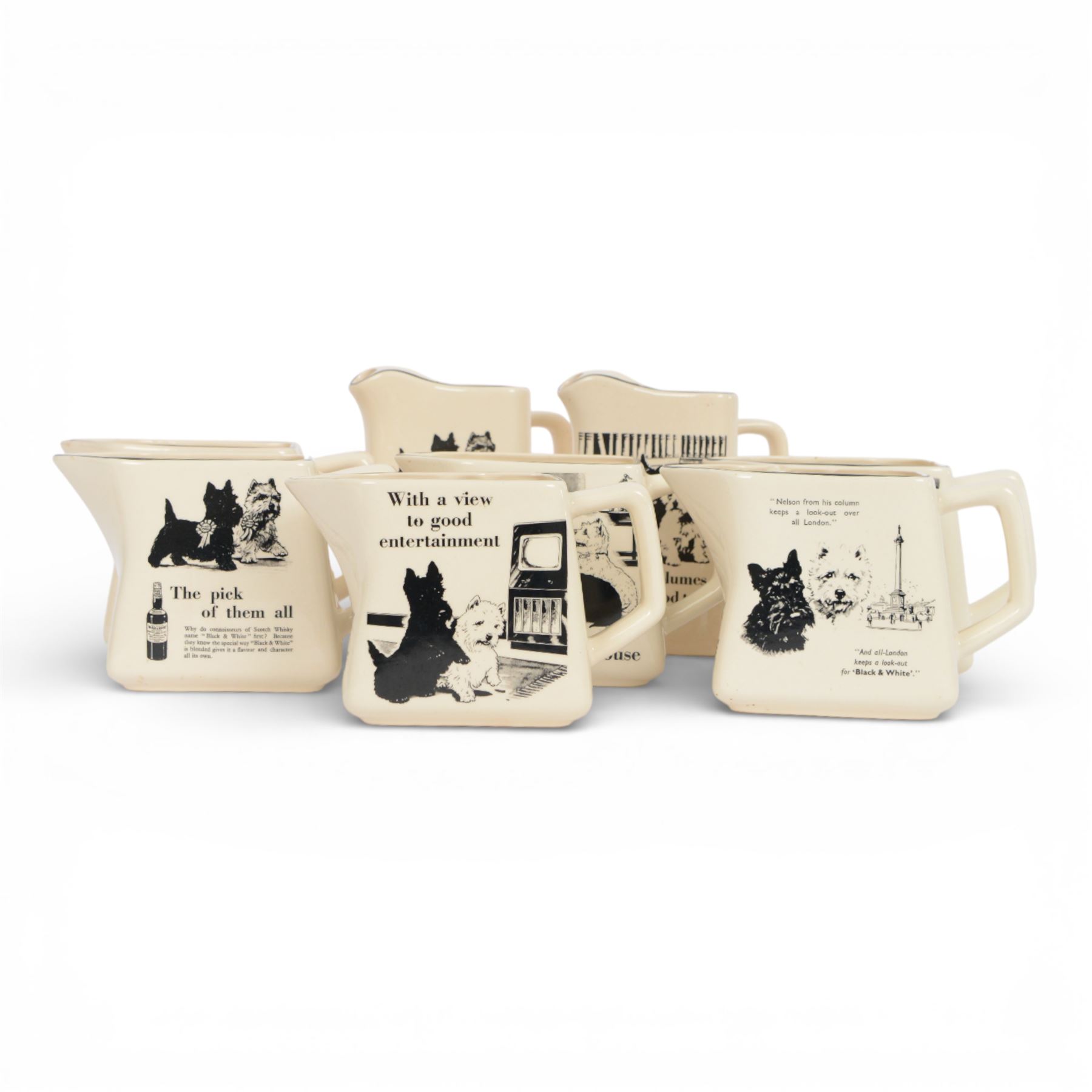 Eight Black and White Scotch Whisky advertising jugs