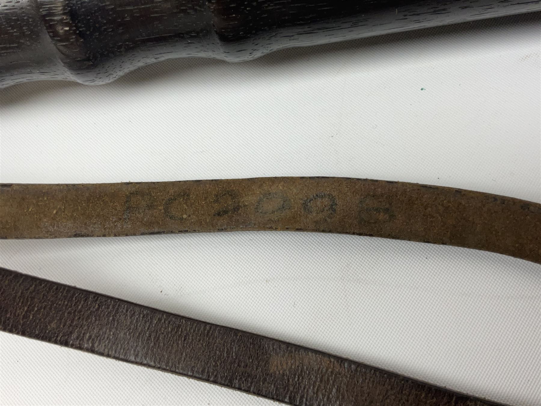 British Transport Police Custodian helmet with Queen's Crown plate; Hiatt & Co ebonised hardwood patrol truncheon; and pair of Hiatts 1960 hand-cuffs (3)