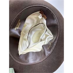 Akubra pure fur felt trilby hat, together with another trilby and two top hats, one by Woodrow and one by Dunn & Co