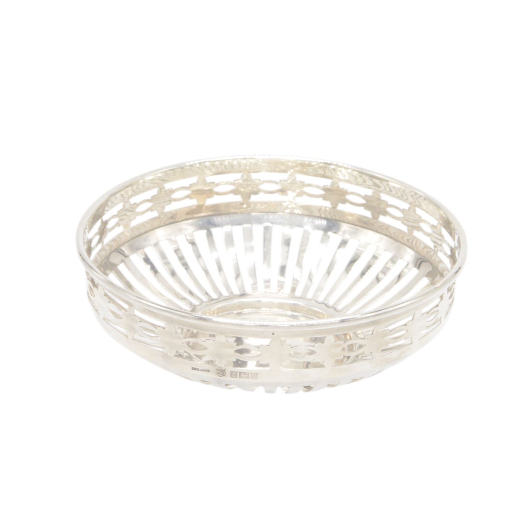 Three mid 20th century silver bowls, including two circular examples with pierced sides and a square example with twin handles, all hallmarked