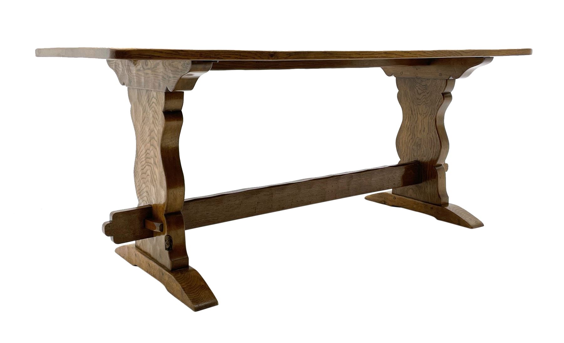‘Gnomeman’ oak dining table, rectangular adzed top, shaped end supports on sledge feet joined by pegged stretcher, carved with gnome signature, by Thomas Whittaker of Littlebeck