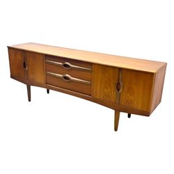 Stonehill - mid-20th century teak sideboard, three central drawers flanked by concertina cupboard doors, on tapering supports