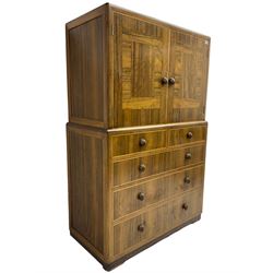 Early 20th century Art Deco walnut cocktail tallboy chest, fitted with double cupboard enclosing two shelves over two short and three long drawers, each with shell shaped handes