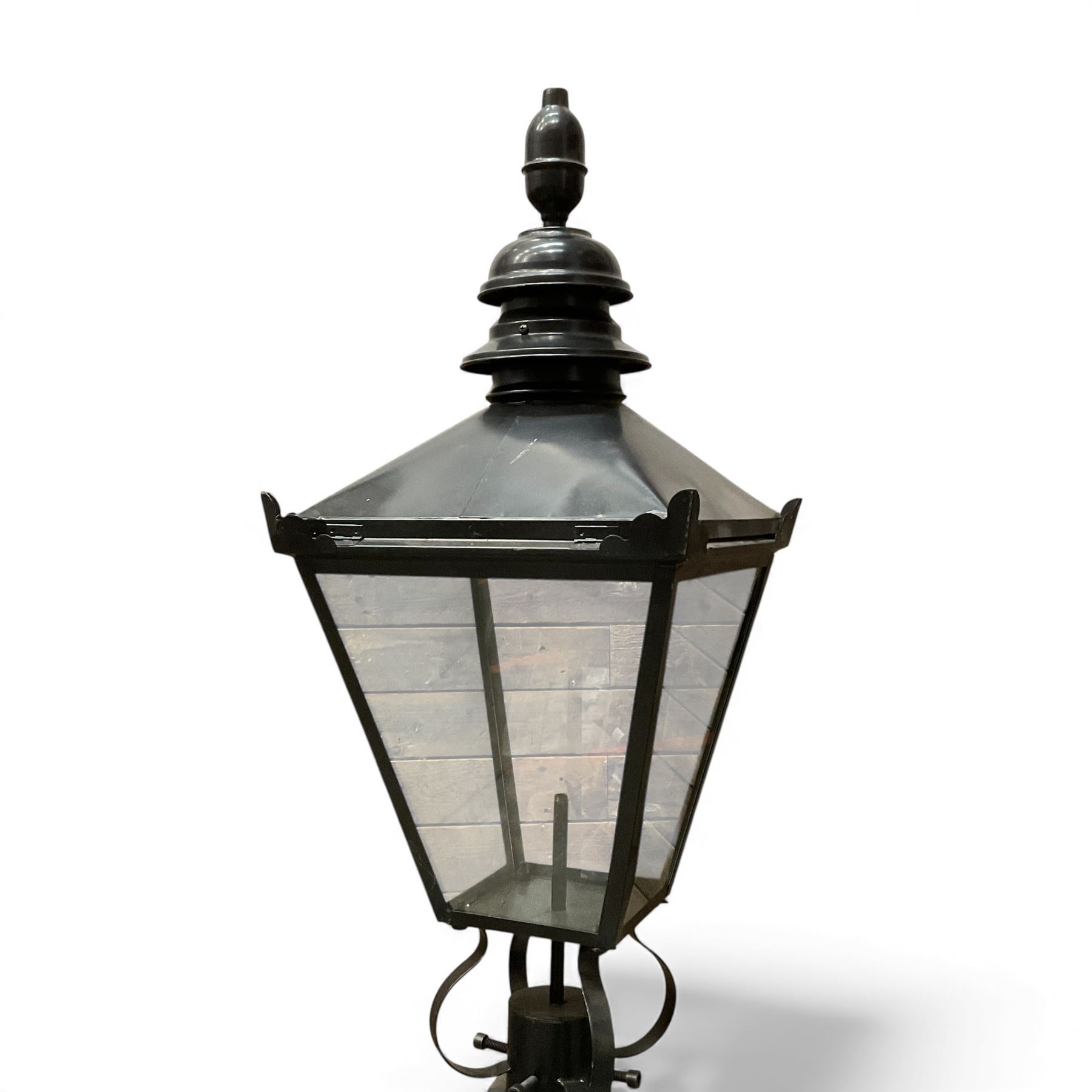 Victorian-style cast iron lamp post in a black finish,