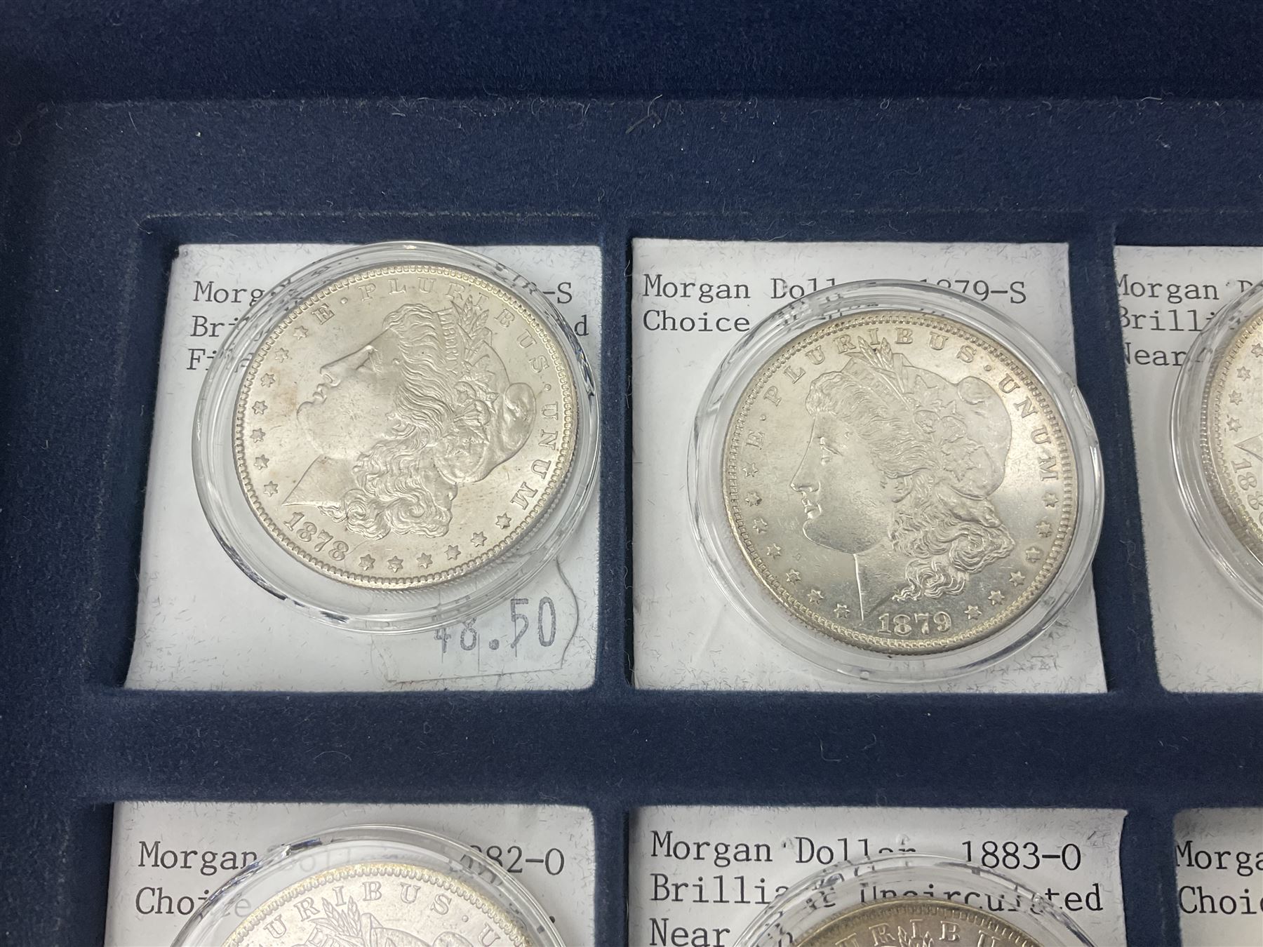 Twelve United States of America silver Morgan dollar coins, dated 1878 S, 1879 S, 1880 S, 1881 S, 1882 O, 1883 O, 1884 O, 1884 CC, 1885 O, 1886, 1887 and 1888