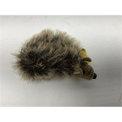 Group of Steiff figures, comprising Mikki and Mukki, circa 1950s no 7628/12 and 7627/12, with original tags, two hedgehogs no 1570/10, and another smaller 1670/03, small owl no 7480/06, and painted metal Steiff harlequin style bear
