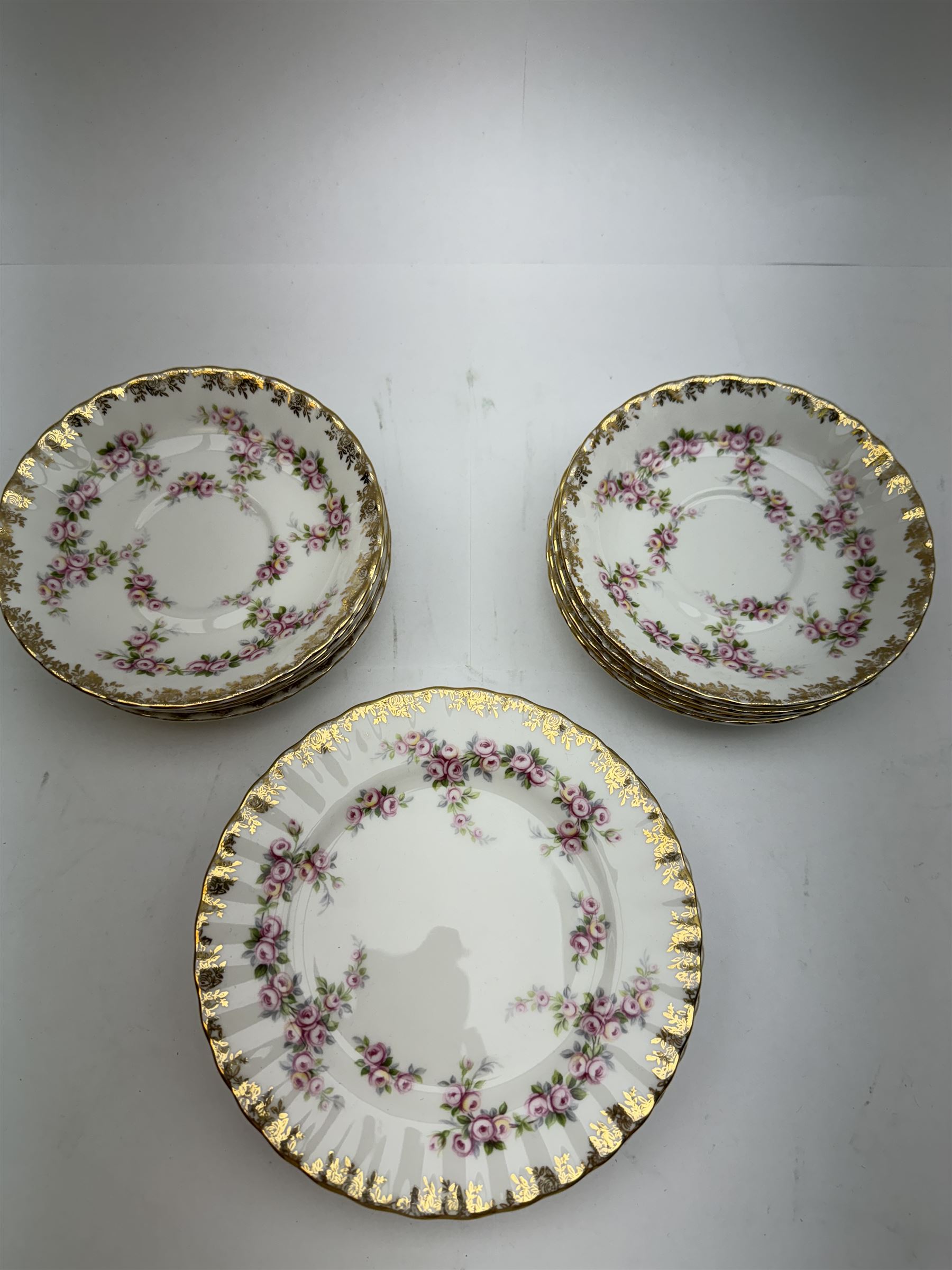 Royal Albert Dimity Rose pattern tea service for six place settings, including teapot, teacups and saucers, sugar bowl and two milk jugs, all with printed mark beneath