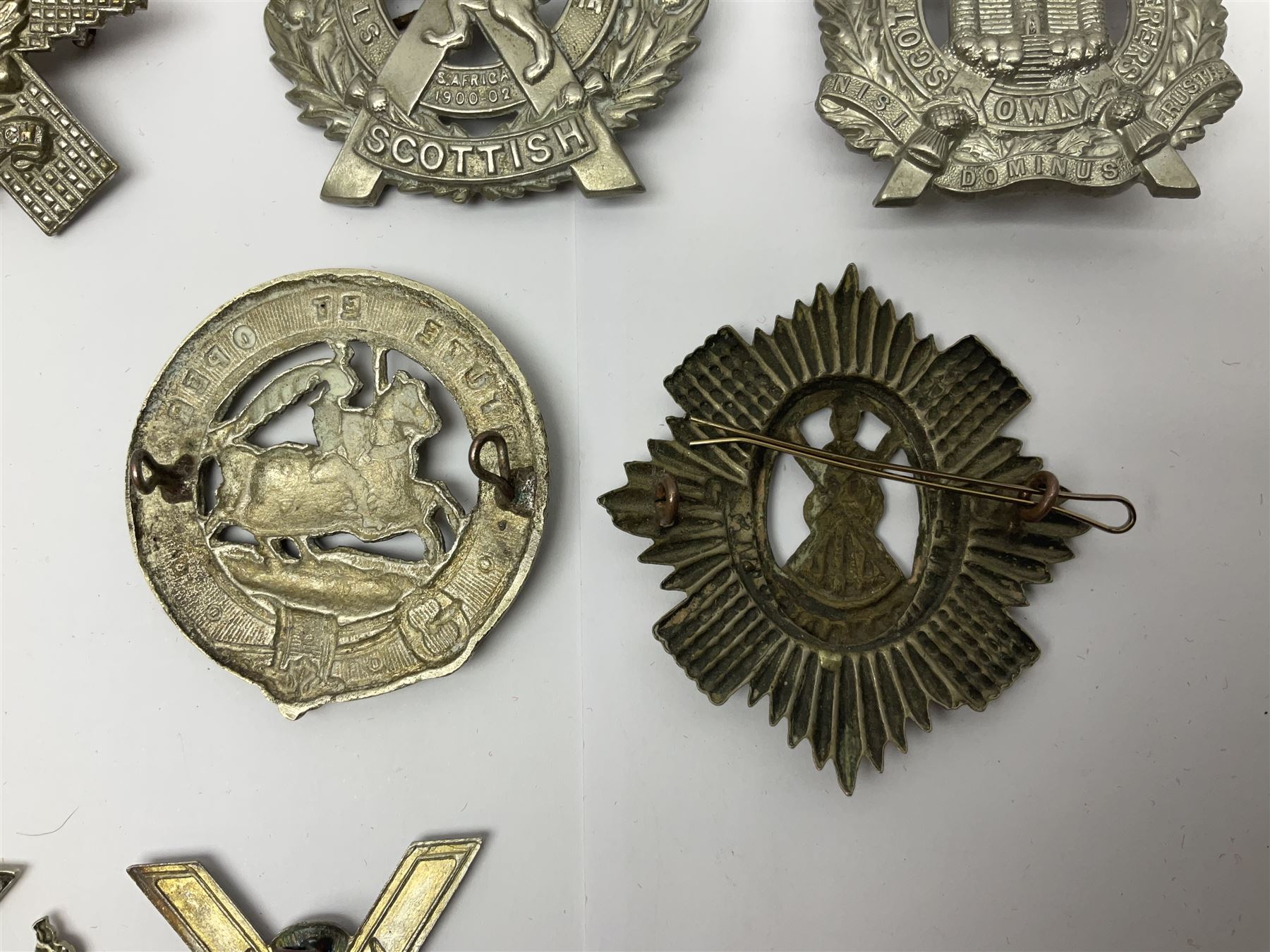Nine Scottish glengarry badges - 6th Fifeshire Volunteer Battalion Black Watch, Lowland Regiment, Highland Regiment, Black Watch, Argyll & Sutherland Highlanders, Kings Own Scottish Borderers, Cameron Highlanders, The Royal Scots and London Scottish (9)