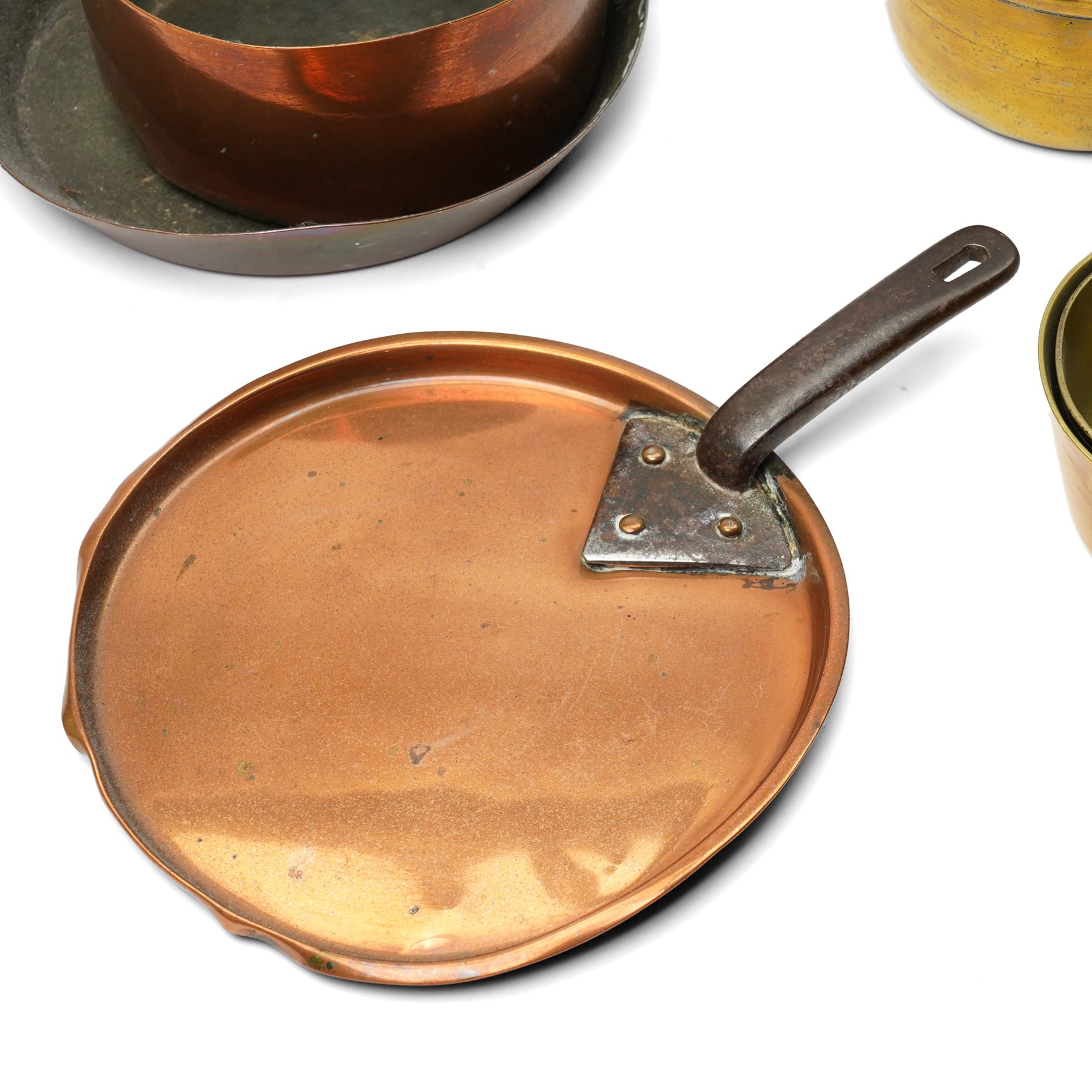 Four Victorian brass saucepans, largest 17cm, copper saucepan 19cm, copper pan and lid