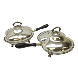  Pair late Victorian silver-plated twin division chafing dishes, by William Hutton & Sons, with beaded borders, scroll and beaded loop handles, the lids engraved with crest above '47' and turned ebonised handles, L47cm (2)  
