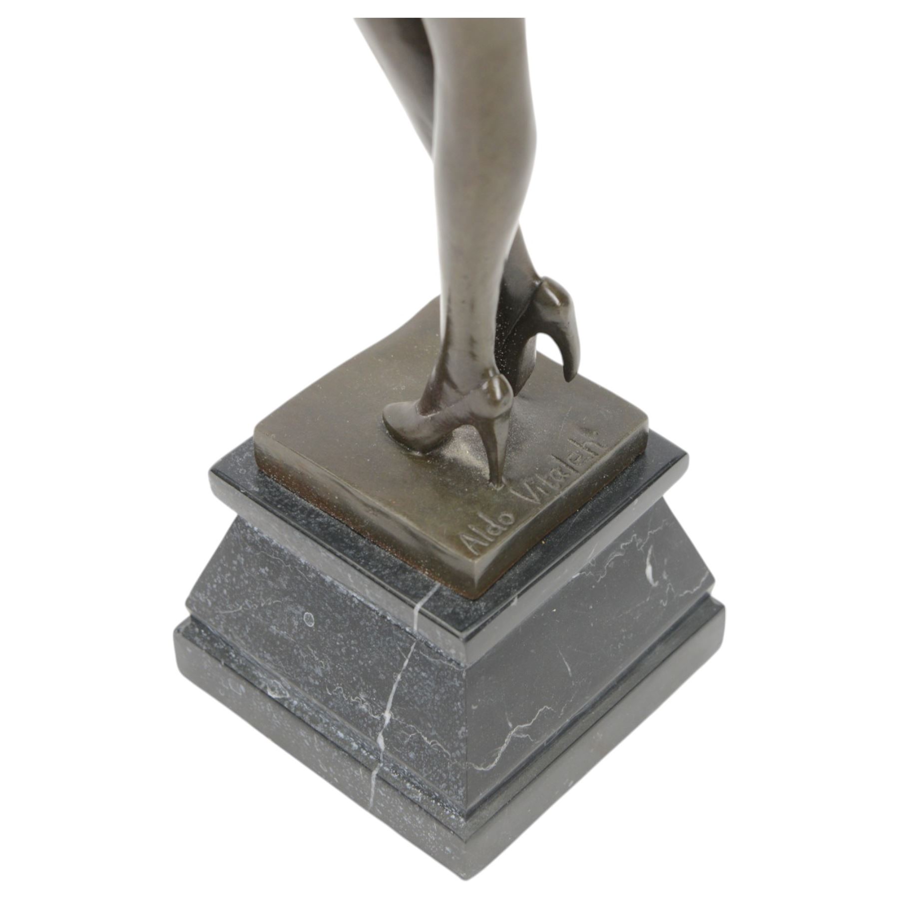 Bronze figure of a dancing nude female after Aldo Vitaleh, with signature to base, upon a black marble effect plinth, H55cm