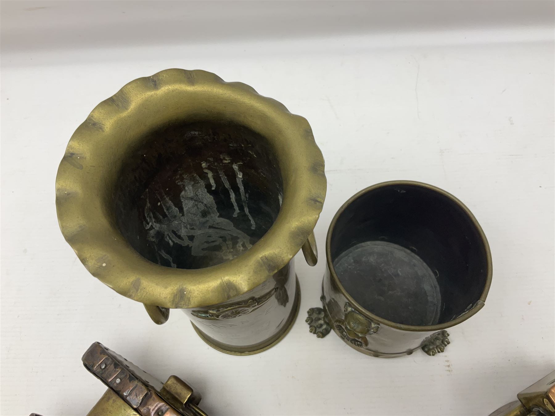 Trench Art - WWI 0-8-0 steam locomotive made from brass, copper and late Victorian pennies and half-pennies L17.5cm; WWI brass and copper tank candleholder; WWI brass shell case two-handled vase inscribed 'RFA France 1914-17'; and an unrelated brass plant holder (4)