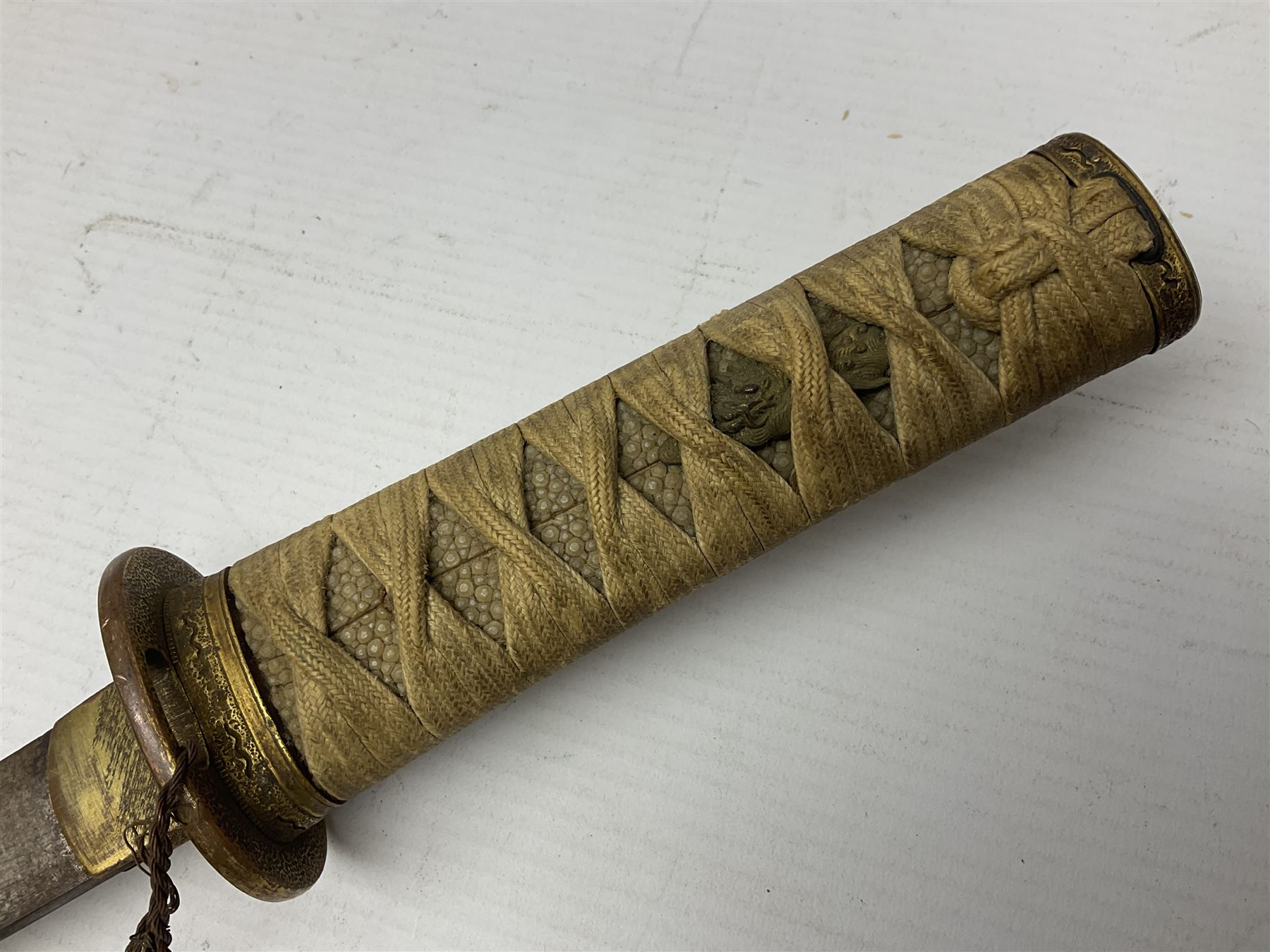 Japanese tanto dagger with 25cm single edged blade, gilded plain punched tsuba, cord bound ray skin grip incorporating menuki and ornate gilded metal mounts L39cm overall