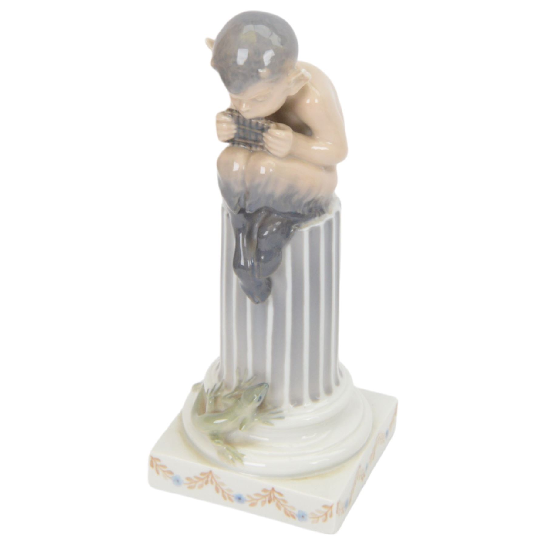 Two Royal Copenhagen figurines of fawns, comprising a fawn with an owl, no 2107 and fawn on plinth no 433, together with Bing & Grondahl, figure of a parrot on branch