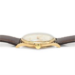 Garrard gentleman's 9ct gold manual wind wristwatch, silvered dial with Arabic hour markers and subsidiary seconds dial, the back case with personalised engraving, London 1974, on brown leather strap