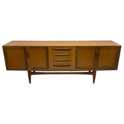 G-Plan - teak sideboard, four graduating central drawers flanked by double panelled cupboards