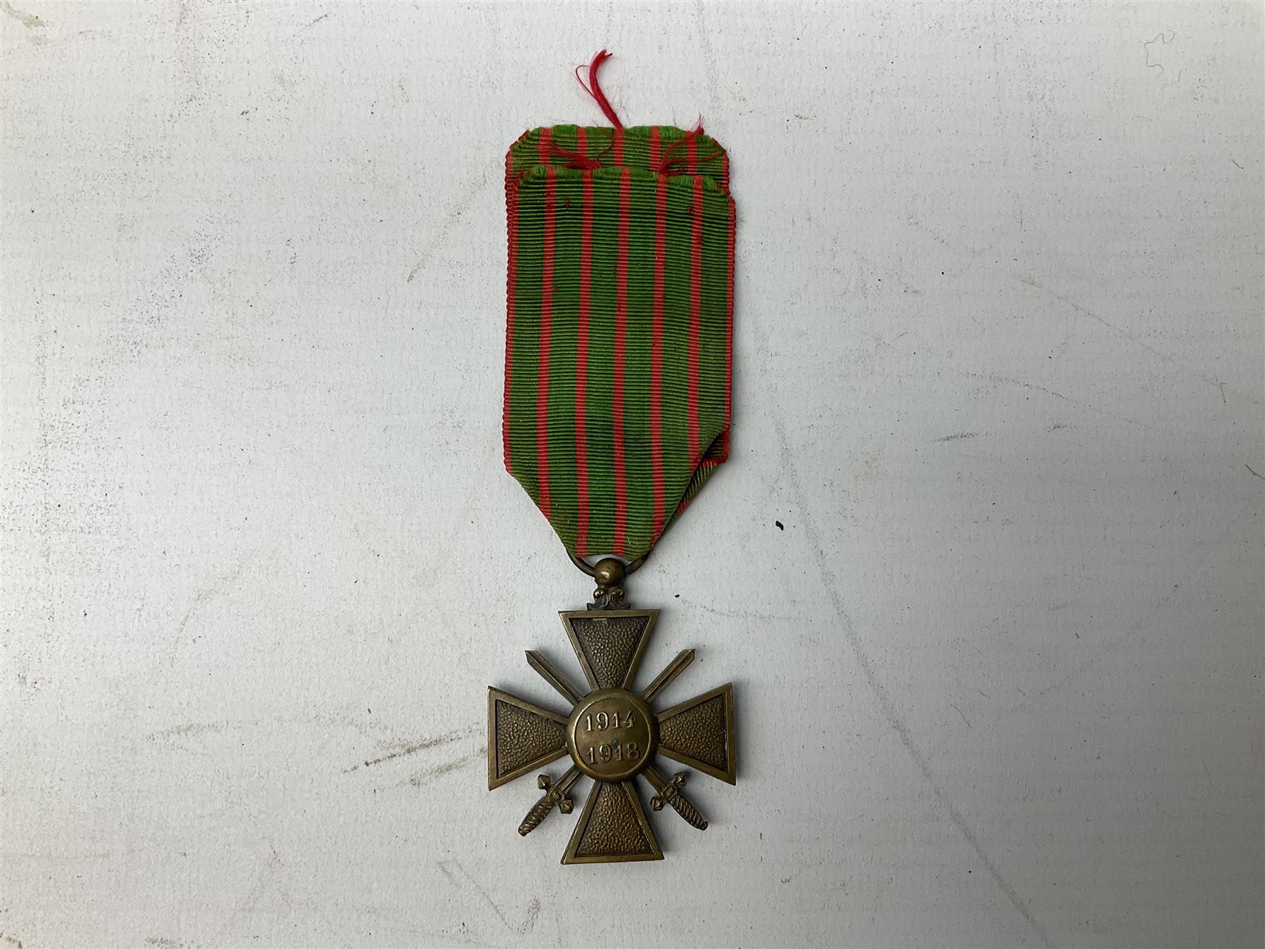 Five continental medals - WW1 Belgian Cross of Fire; WW1 French Croix De Guerre; French Croix De Combattant; French Republic Workers silver merit awarded to L. Mounet 1950; and boxed French Palmes Universitaires Officier d'Academie silver and enamel wreath (5)