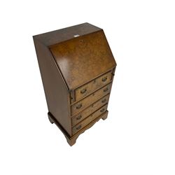 Mid-20th century Georgian design figured walnut bureau, the fall front enclosing small drawers and pigeon holes, fitted with four drawers, on bracket supports