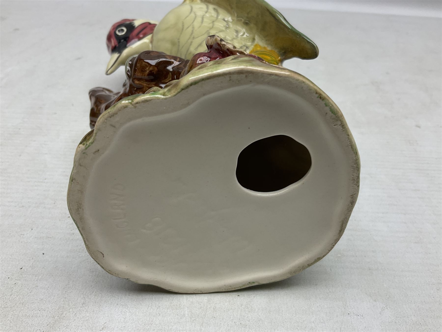 Three Beswick figures of birds, comprising pheasant no 1225, magpie no 2305 and woodpecker 1218, all with impressed marks beneath, tallest H22cm