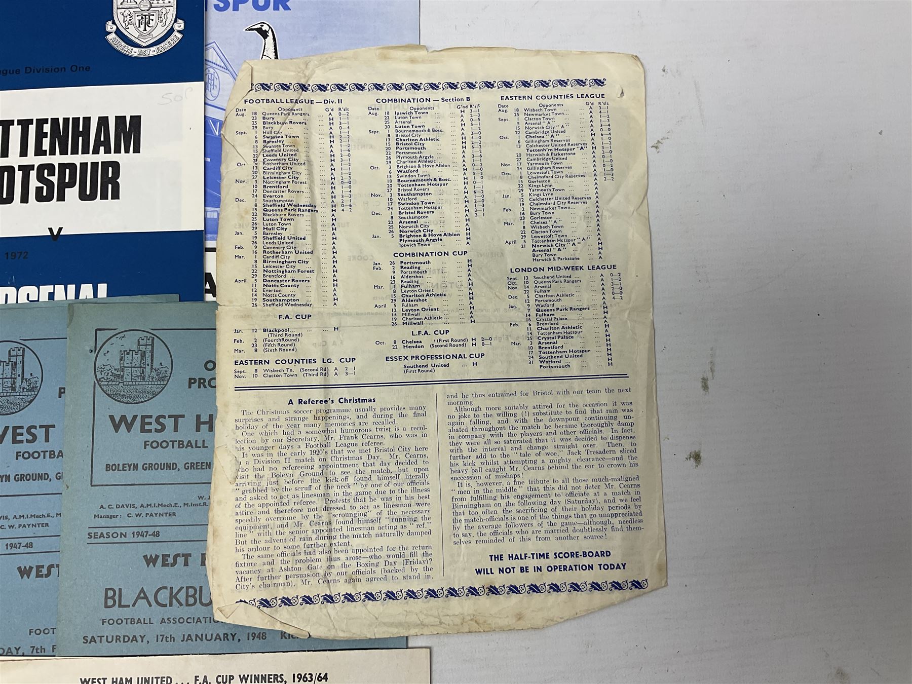 West Ham United - eight 1940s/50s home programmes for 1947/48 - 1951/52 and another for 1986/87 and two team photographs; together with eight Tottenham Hotspur home programmes 1952/53 - 1976/77 (17)
