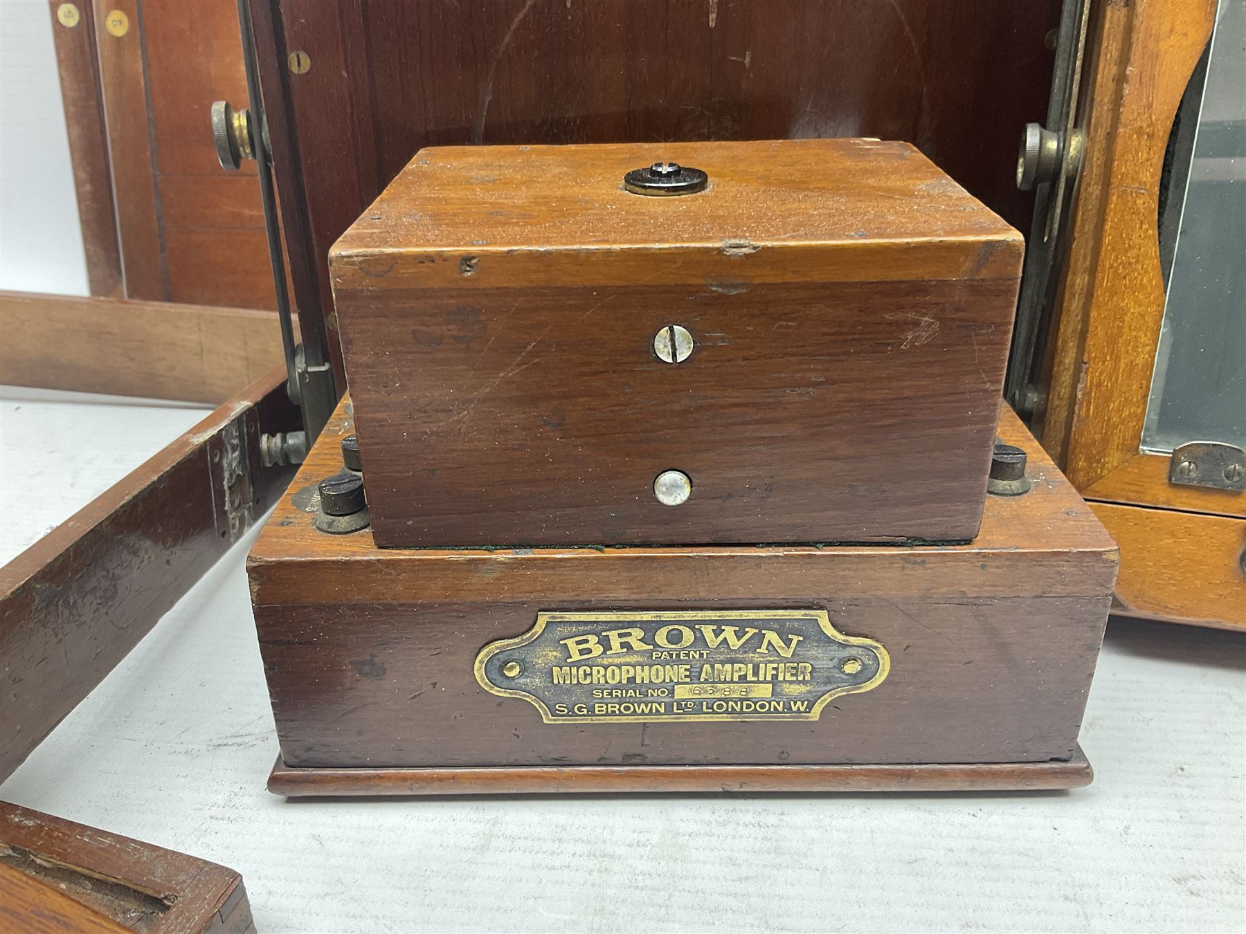 Collation of folding plate cameras of various sizes folding plate in mahogany and lacquered brass, together with camera plates and slides
By vendors repute some slide are from the Gandolfi workshop