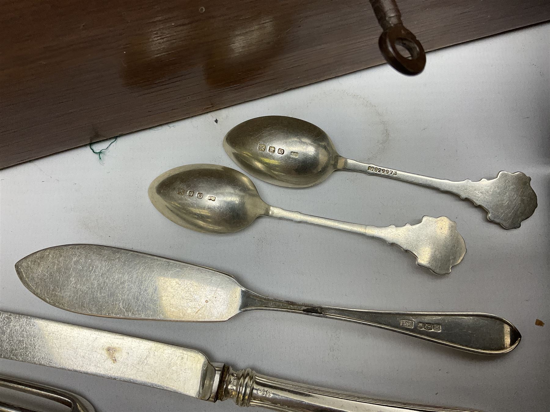 Walker & Hall silver-plate part canteen of cutlery, together with hallmarked silver cutlery comprising pair of Robert Pringle & Sons teaspoons, fork and butter knife, and silver handled knife and fork, cased set of Walker & Hall fish servers with simulated bone handles, and quantity of silver-plate and other cutlery