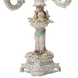 Pair of German porcelain three branch candelabra, the based modelled with putti holding flowers, printed blue mark to base, H35cm (2)