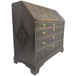 18th century heavily carved oak bureau, the fall front relief carved with three arches enclosing plants and flower head decoration, the interior fitted with pigeonholes, drawers and cupboard, four graduating cock-beaded drawers below, carved with lunettes and trailing foliage decoration, on bracket feet