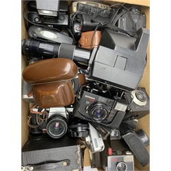  A large group of assorted cameras, to include an Ilford Sportsman 300, a Praktica Super TL2, a Konica C35, a Polaroid Supercolor 635, together with a quantity of fitted cases and some lenses.   