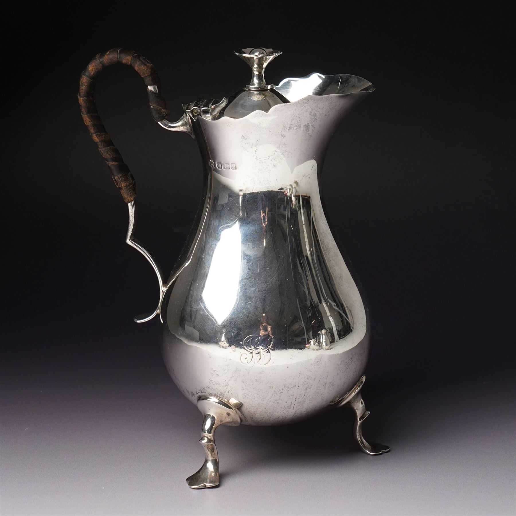 Silver matched five piece tea and coffee set of baluster form engraved with a monogram on shaped supports Sheffield 1913, the teapot 1911, the coffee pot 1924 Maker Mappin & Webb